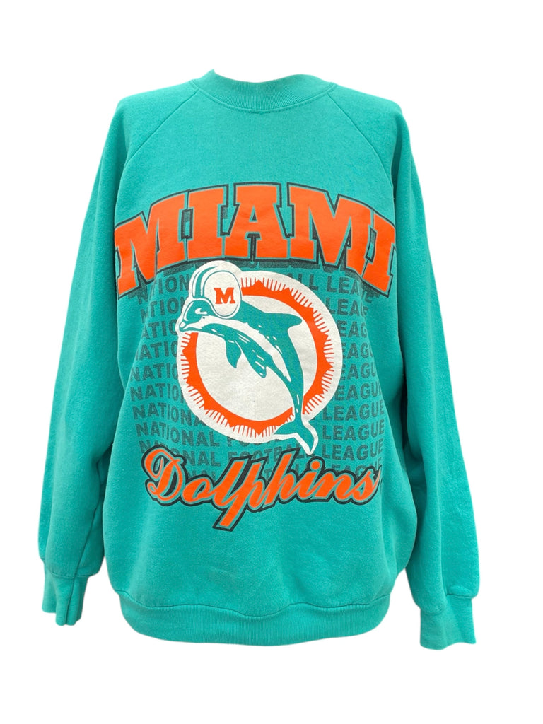 Teal sweatshirt with 'Miami Dolphins' logo on a white background