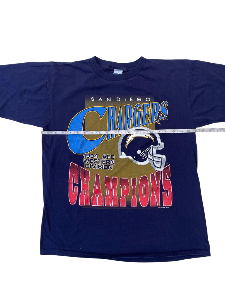 Navy blue t-shirt with 'San Diego Chargers Champions' text and helmet graphic on a white background