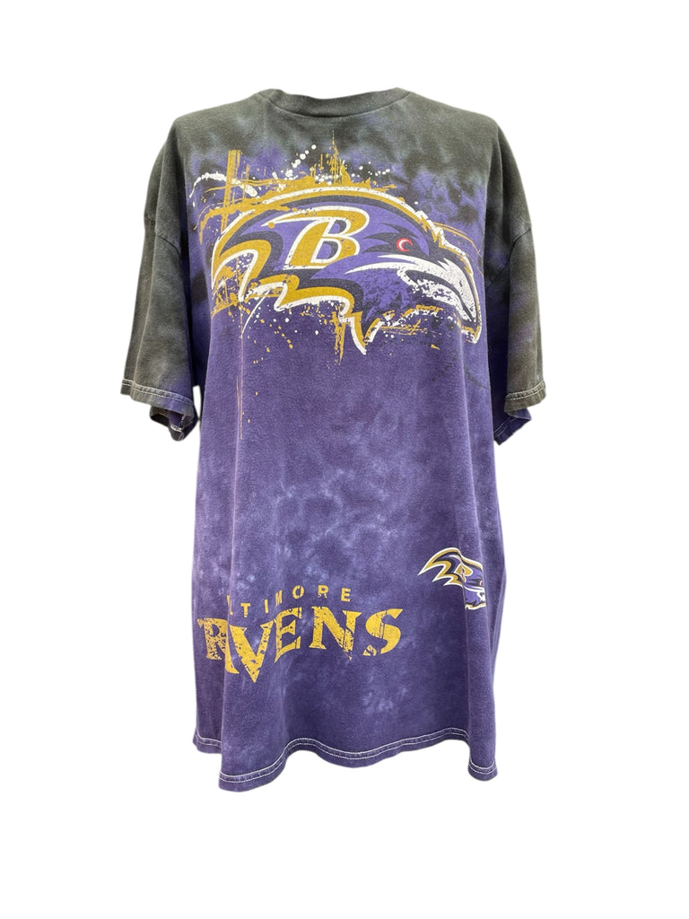 Purple and gray t-shirt with Baltimore Ravens logo on a white background