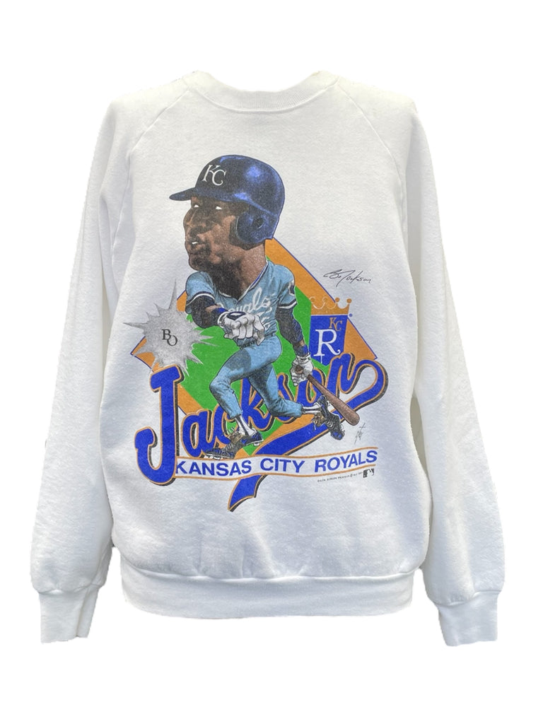 White sweatshirt with a baseball player graphic and 'Kansas City Royals' text on a white background