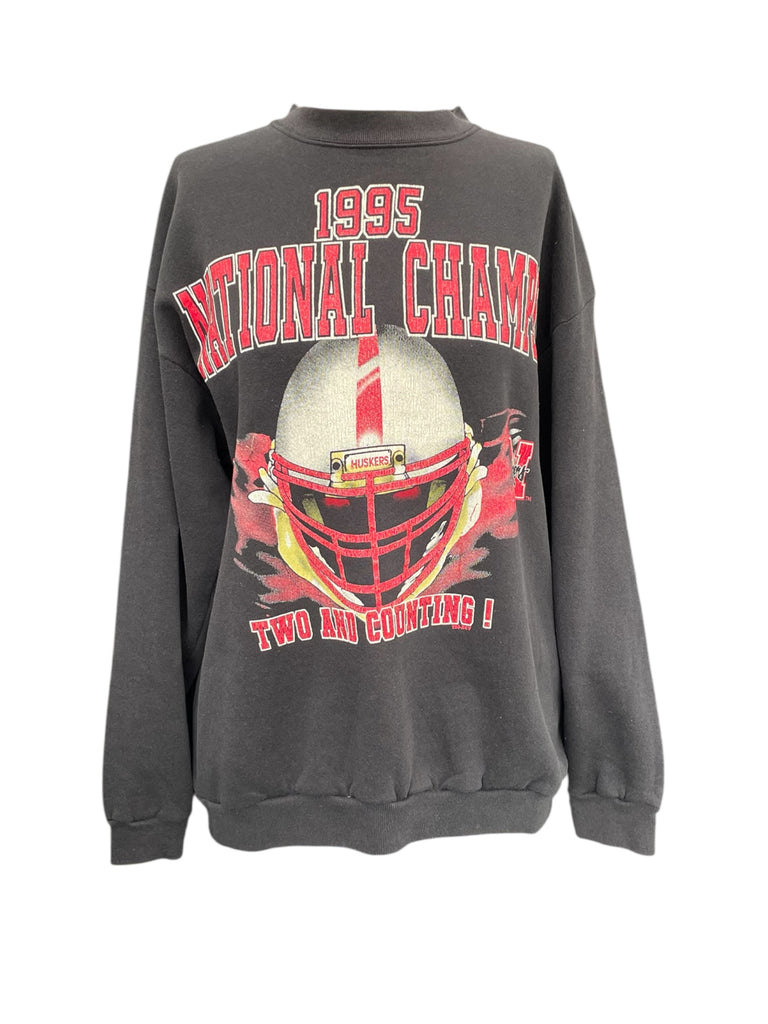Gray sweatshirt with football helmet graphic and text on a white background