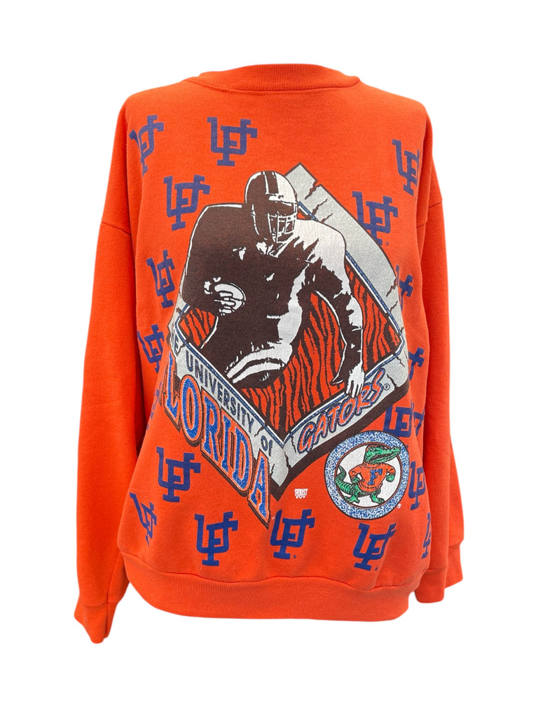 Orange sweatshirt with football player graphic and 'University of Florida Gators' text on a white background