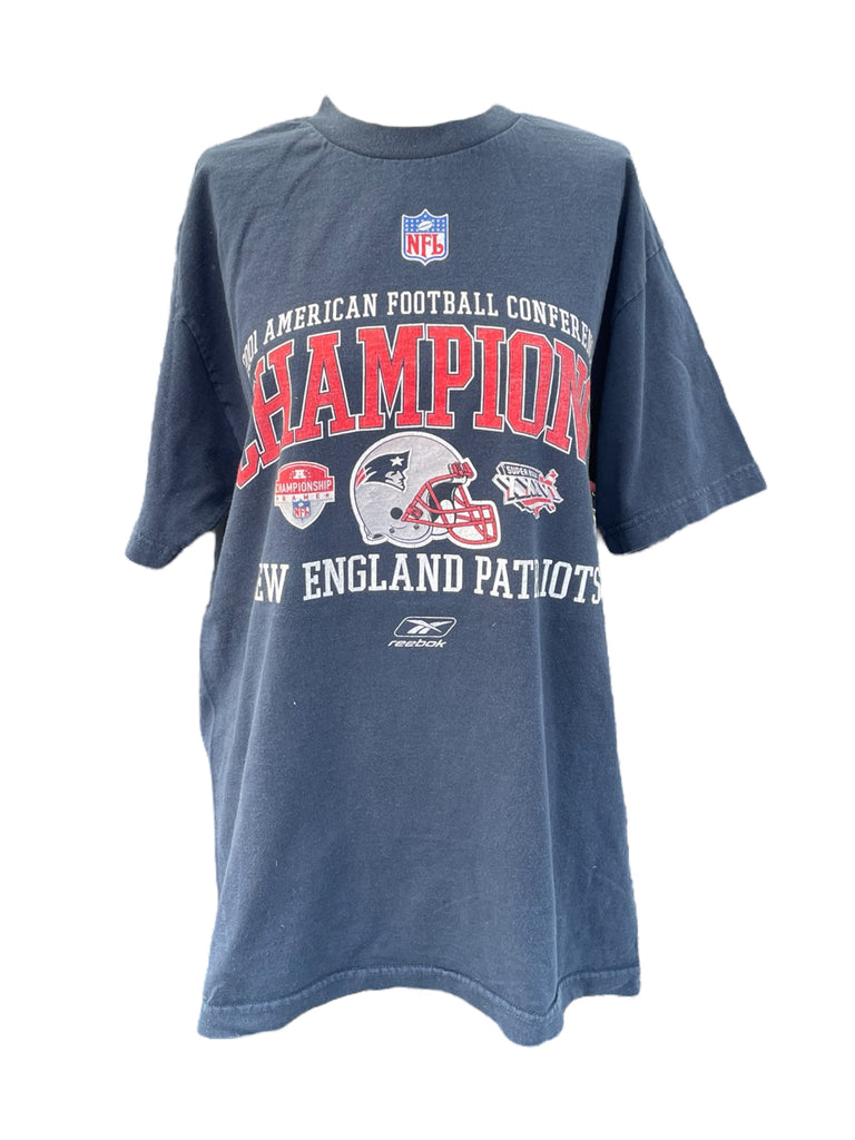 Blue t-shirt with New England Patriots graphics and text on a white background