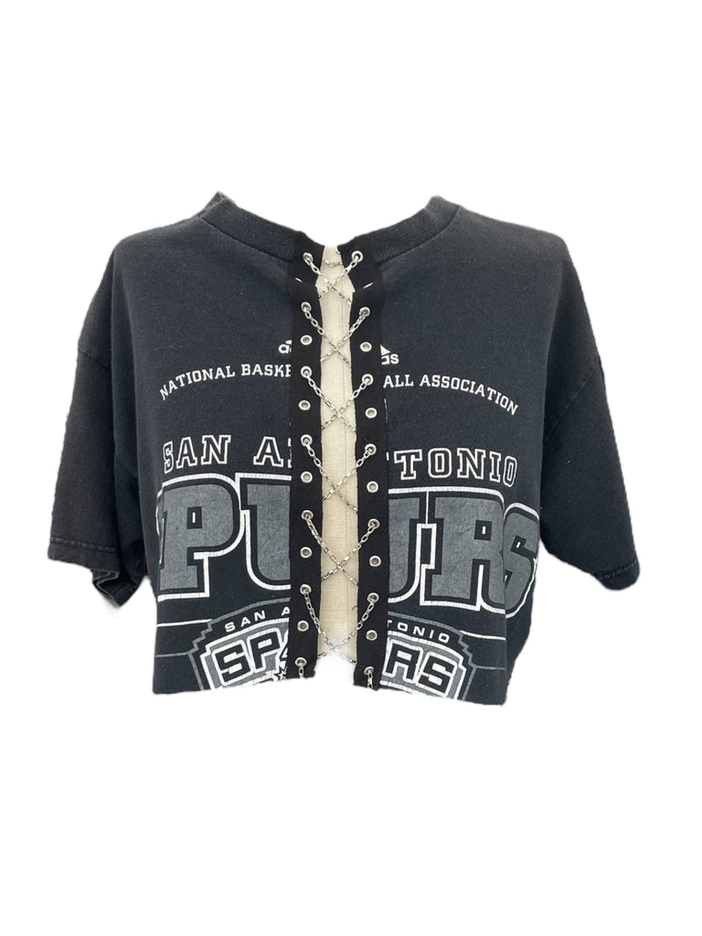 Black  tee chain lace up cropped with white text on a white background