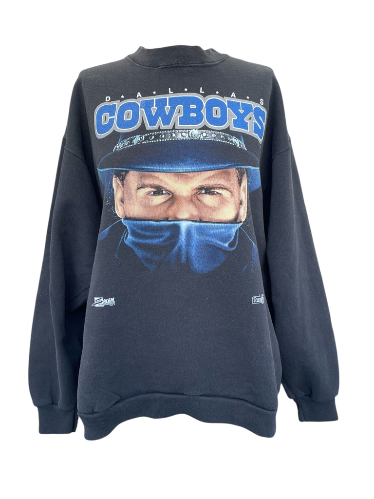 Black sweatshirt with a graphic of a person wearing a helmet and 'Cowboys' text on a white background