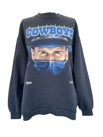 Black sweatshirt with a graphic of a person wearing a helmet and 'Cowboys' text on a white background