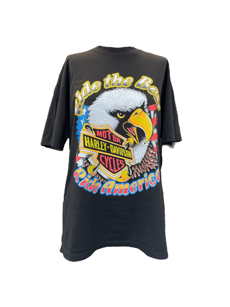 Black t-shirt with a colorful graphic of an eagle and text on a white background