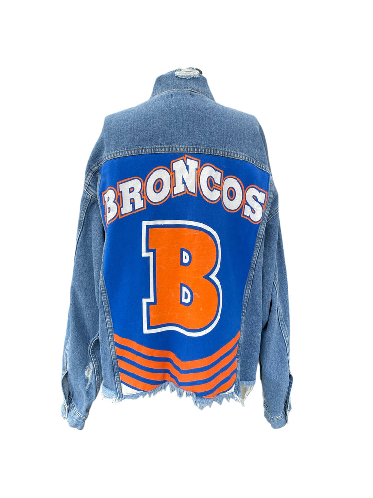 Denim jacket with 'BRONCOS' and a large 'B' on the back, on a white background