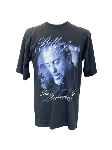 Black t-shirt with a graphic of a man's face and text on a white background