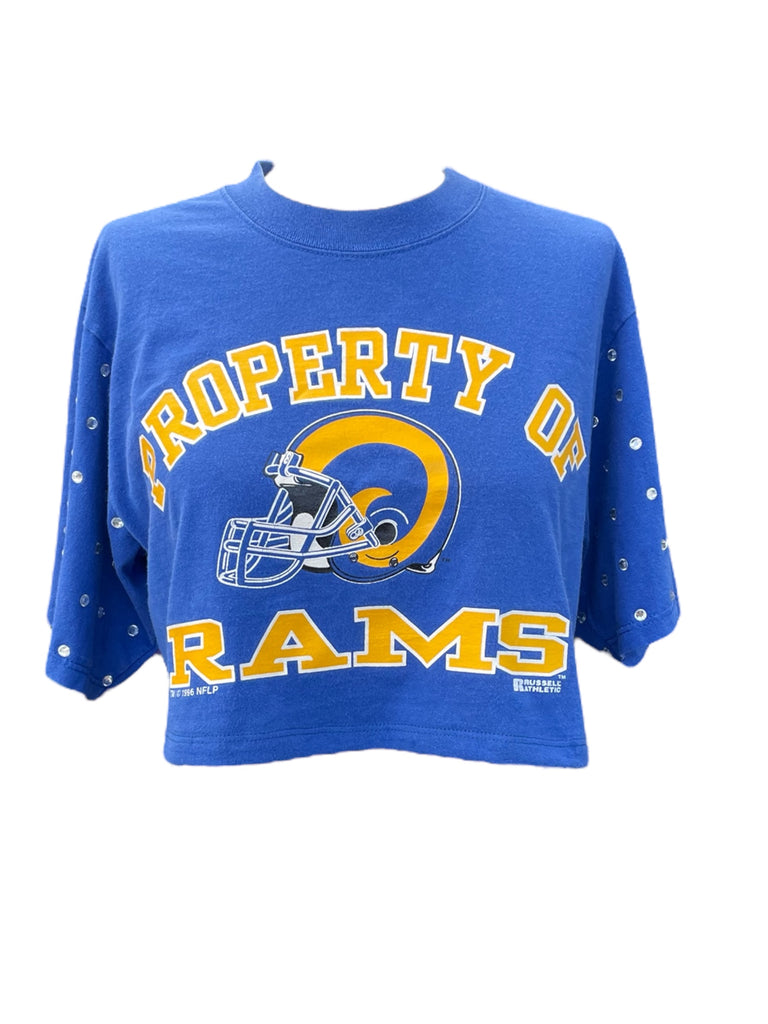 Blue tee with 'Property of Rams' text and logo on a white background