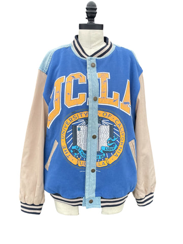 Blue and beige letterman jacket with UCLA logo on a mannequin against a white background