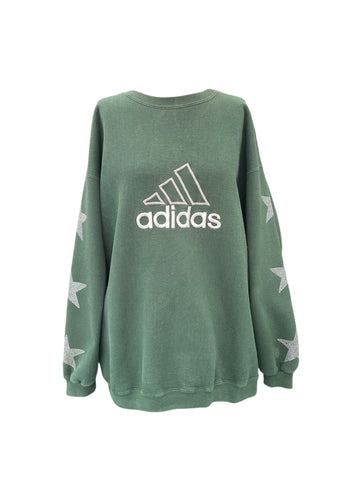 Green Adidas sweatshirt with star patterns on a white background