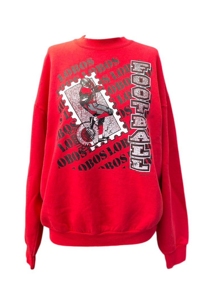 Red sweatshirt with graphic design and text on a white background