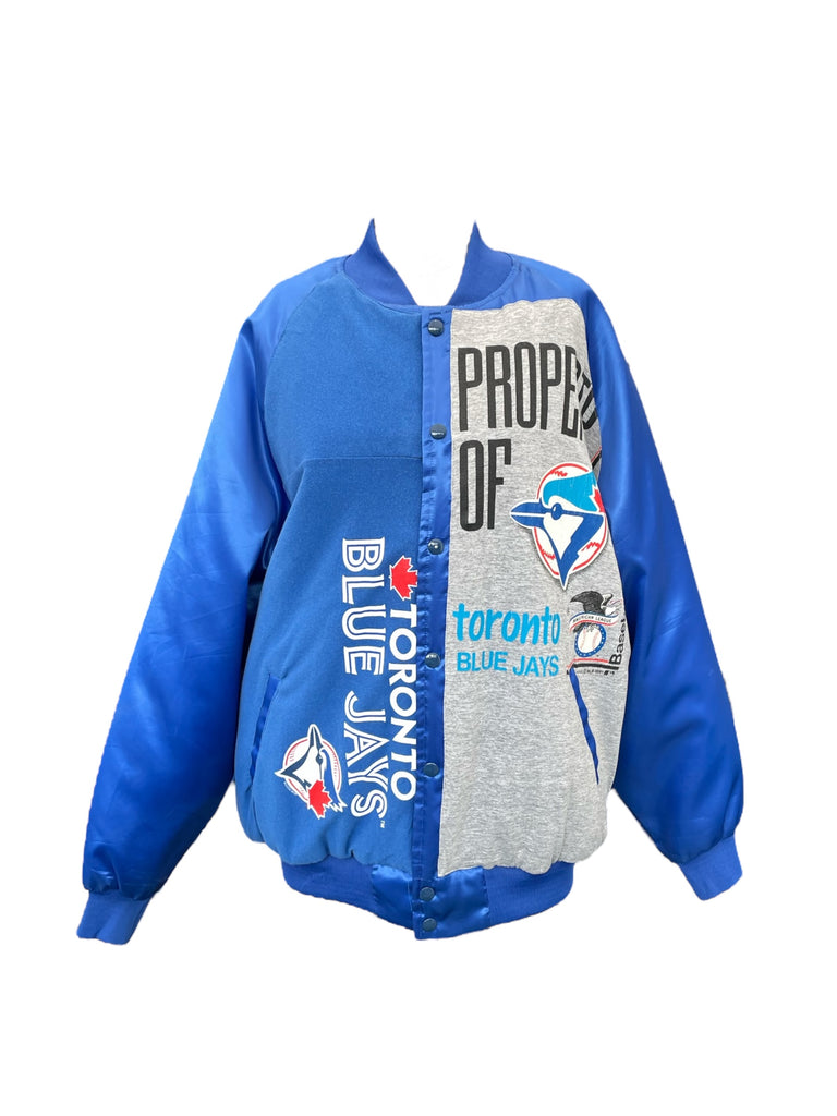Blue and gray jacket with Toronto Blue Jays branding on a white background