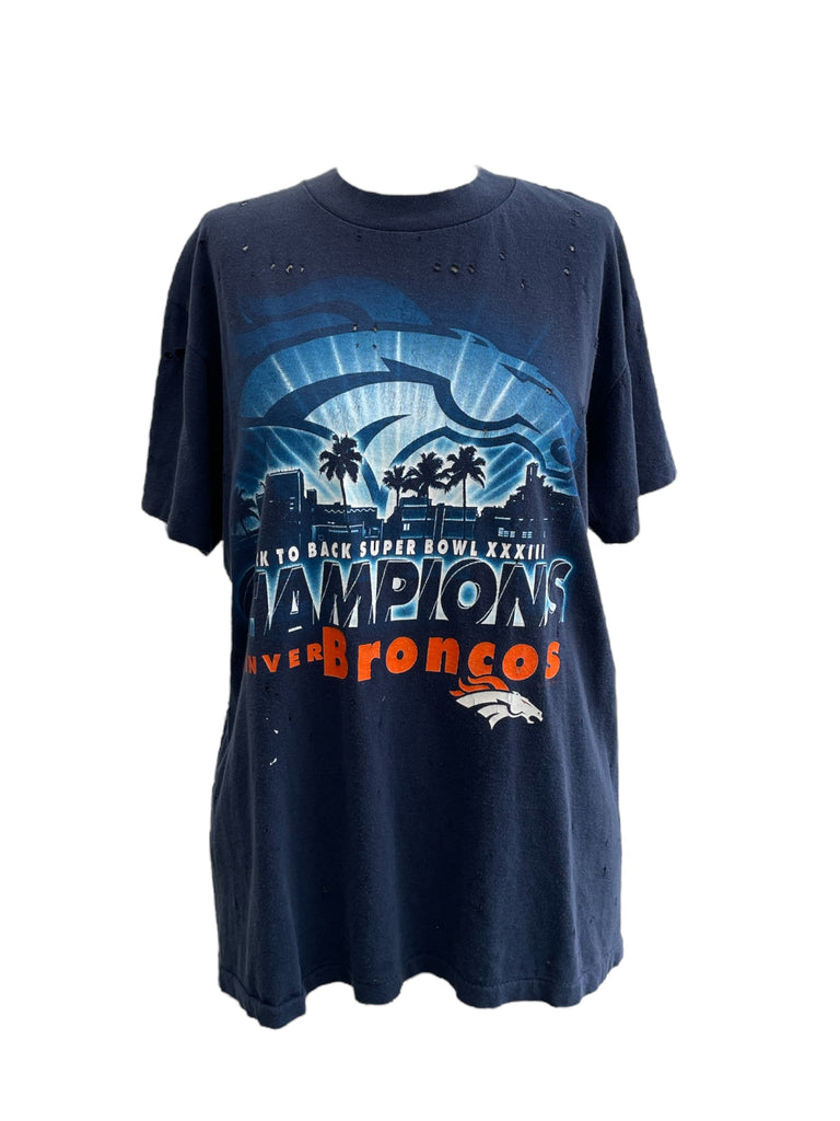 Navy blue t-shirt with sports team graphics and text on a white background