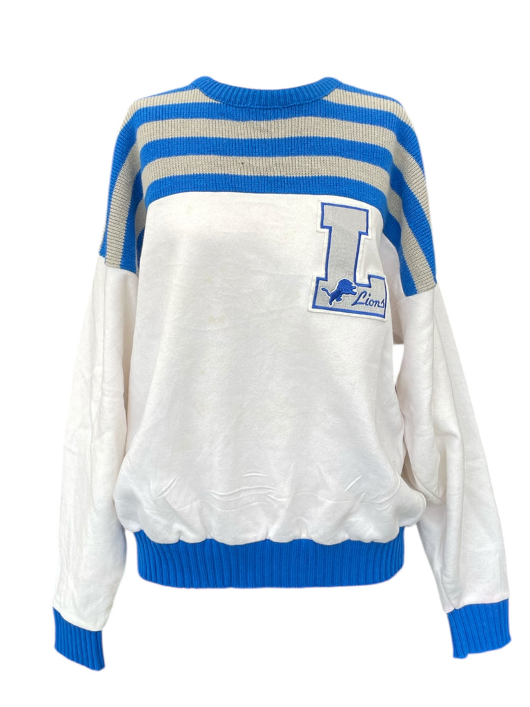 White sweater with blue and gray stripes and a logo on a white background
