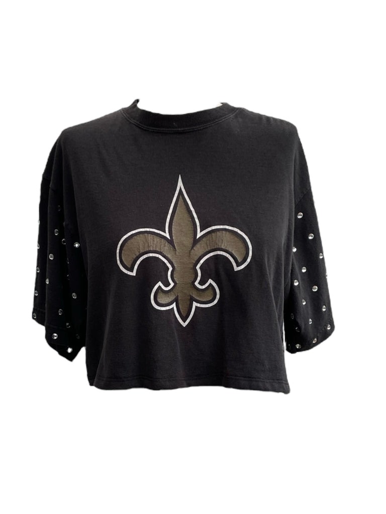 Black t-shirt with a fleur-de-lis logo on a white background